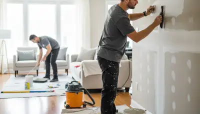 Boulder, CO painters repairing drywall for a smooth, paint-ready wall